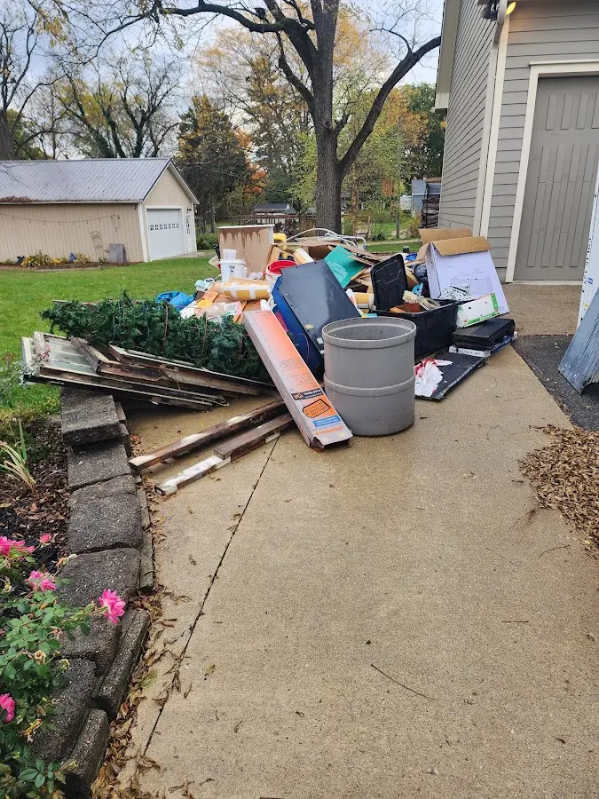 Dumpster being loaded with debris for Commercial Dumpster Rental in Terre du Lac